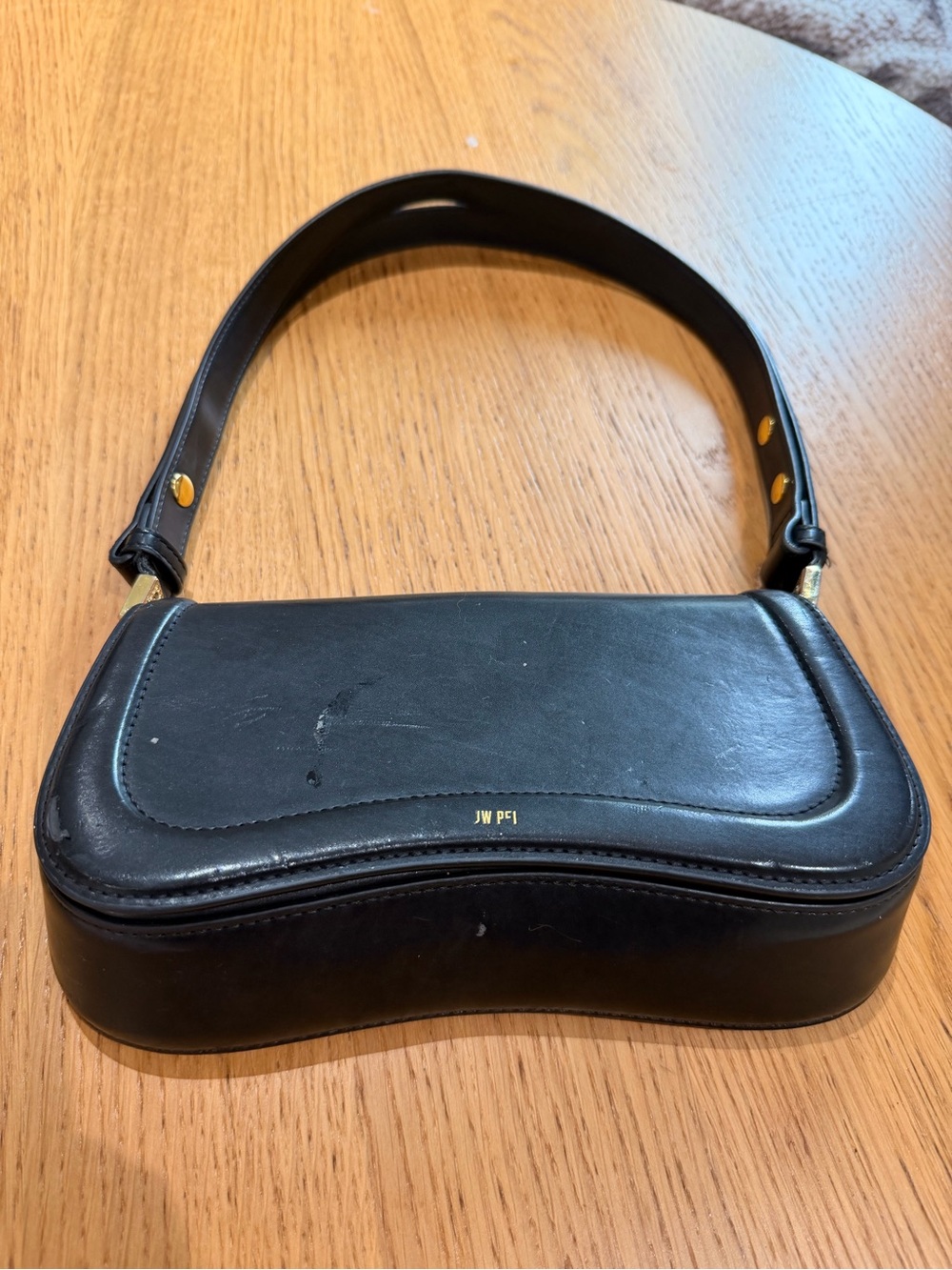JW PEI Black Curved Vegan Leather Shoulder Bag with Gold Accent
